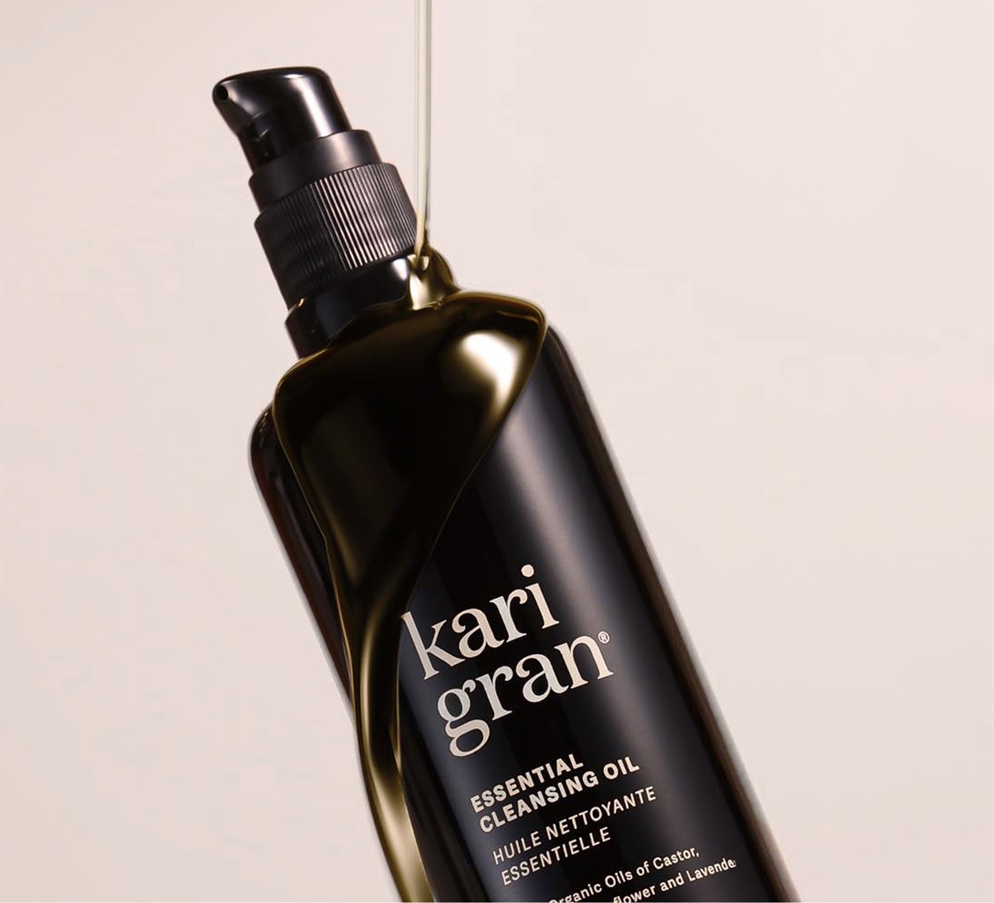 Kari Gran essential cleansing oil bottle on a beige background